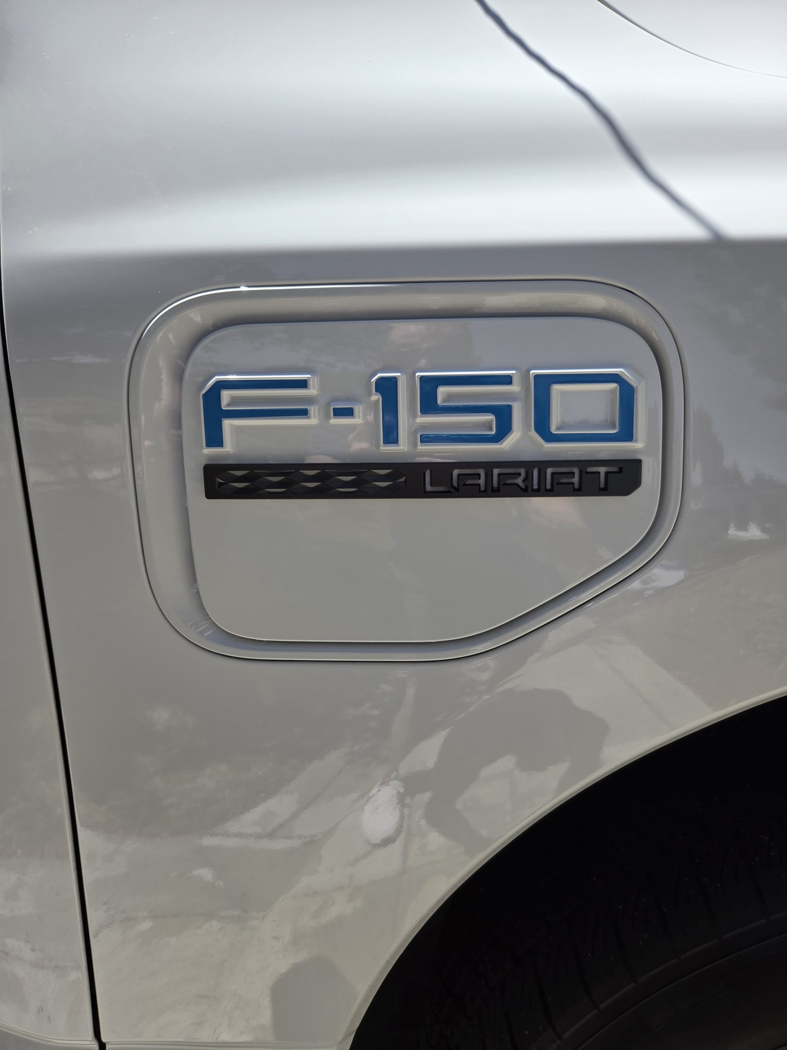 Charge port with Lariat badge